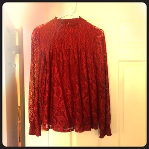 Long sleeve red lace blouse.